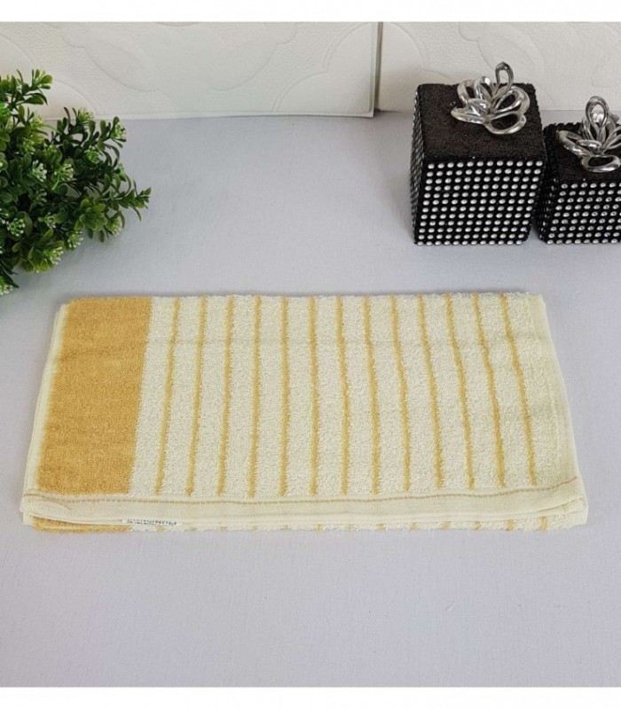 TOALLITA 0.30X0.65 COLOR CREMA CON RAYAS NARANJA